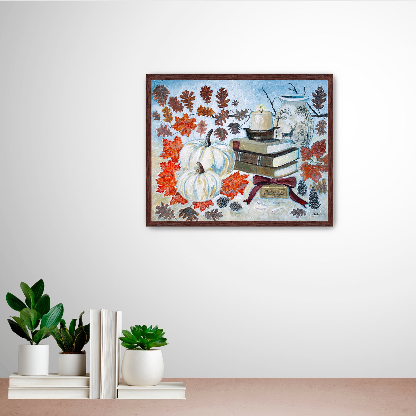 A painting of a cozy autumn still life featuring white pumpkins, vintage books, a red velvet bow and warm fall leaves. A perfect rustic accent for your home decor.