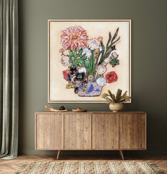 A painting of a colorful flowers including a large dahlia in a blue and white bird vase.