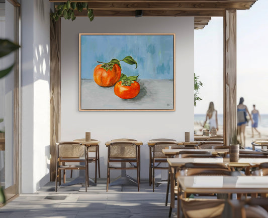 A beautiful oil painting of two persimmons on a blue wall.