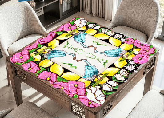 A scalloped mahjong mat featuring an original painting of herons, lemons, lily of the valley and anemones flowers.
