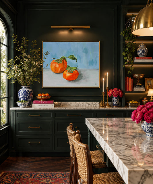 A beautiful oil painting of two persimmons on a blue wall by Deb Baker at Trail East Studio in Ada Michigan