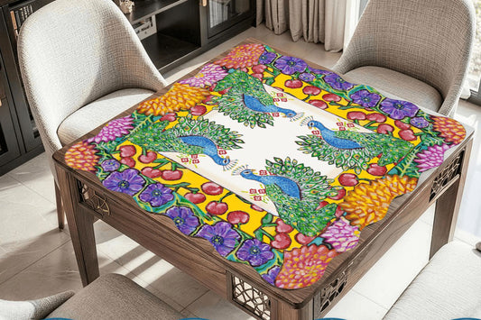 A scalloped mahjong mat featuring an original painting of peacocks, cherries, dahlias and anemones flowers.