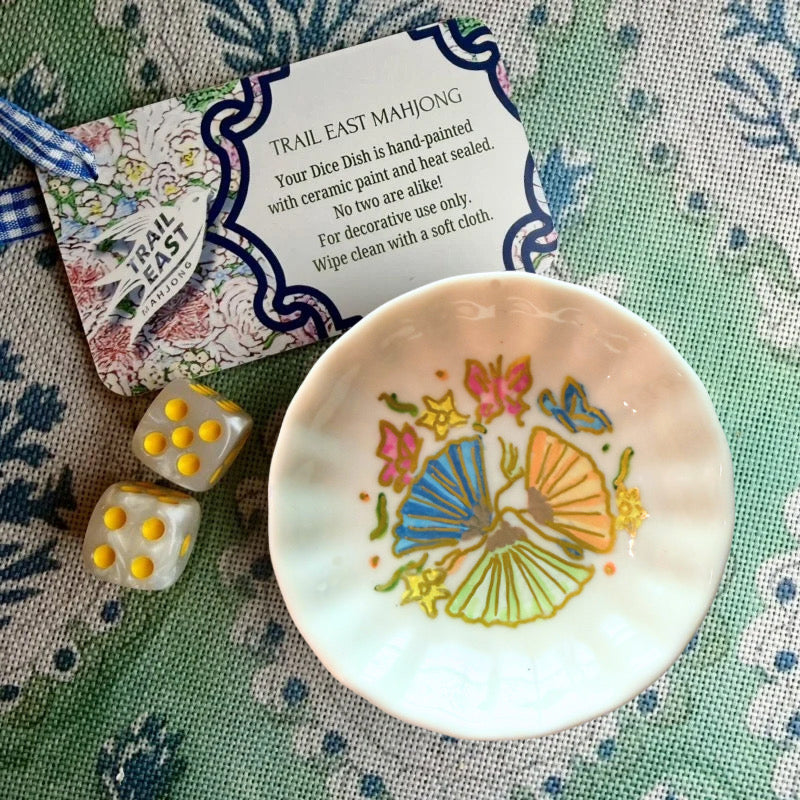 A hand painted Mahjong Dice Dish from Trail East Studio featuring fans, flowers, and butterflies