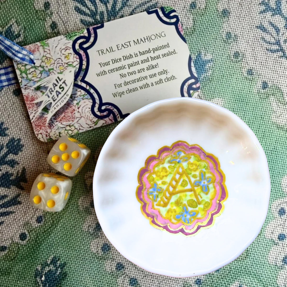 A hand painted monogrammed dice dish featuring a floral motif from Trail East Studio in Ada Michigan
