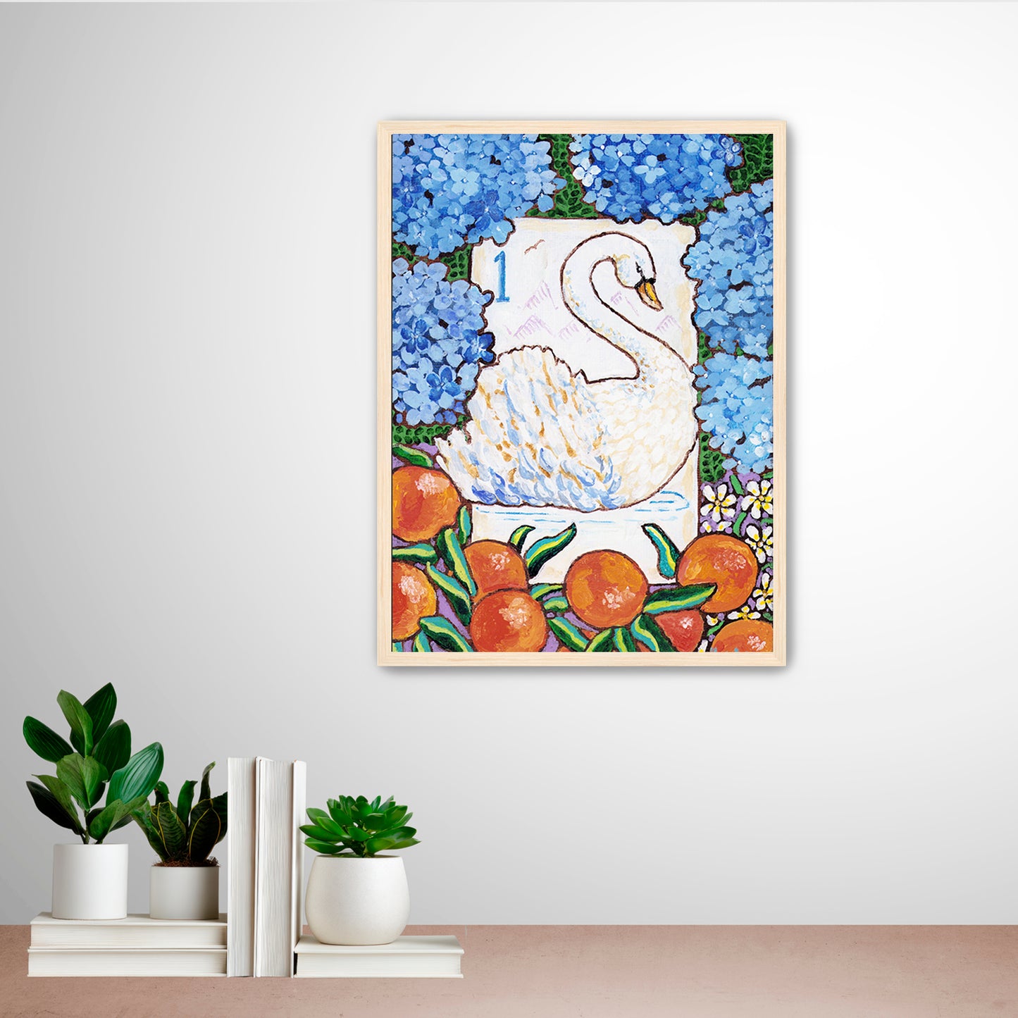 Framed artwork of a swan bird bam Mahjong tile among flowers and fruits on a wall with decorative books and plants below. This art is perfect for a Mahjong game room.