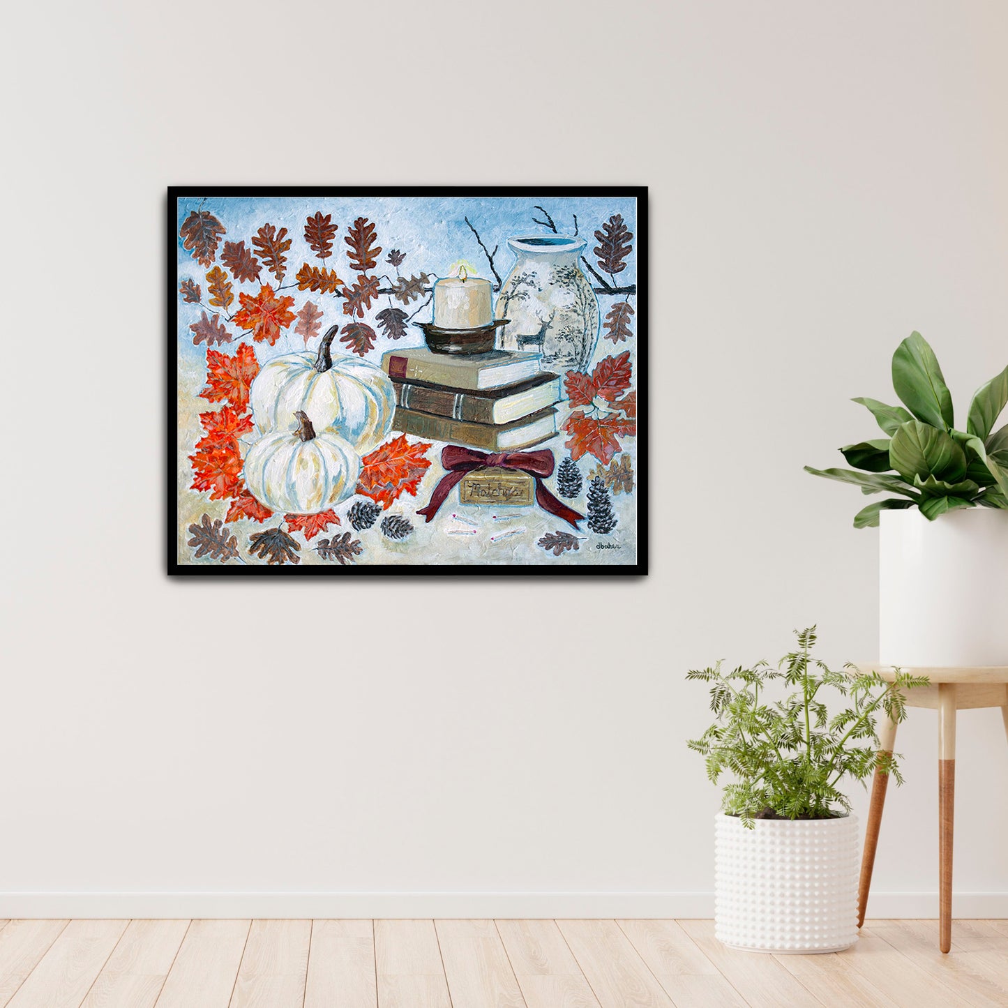 A painting of a cozy autumn still life featuring white pumpkins, vintage books, a red velvet bow and warm fall leaves. A perfect rustic accent for your home decor.
