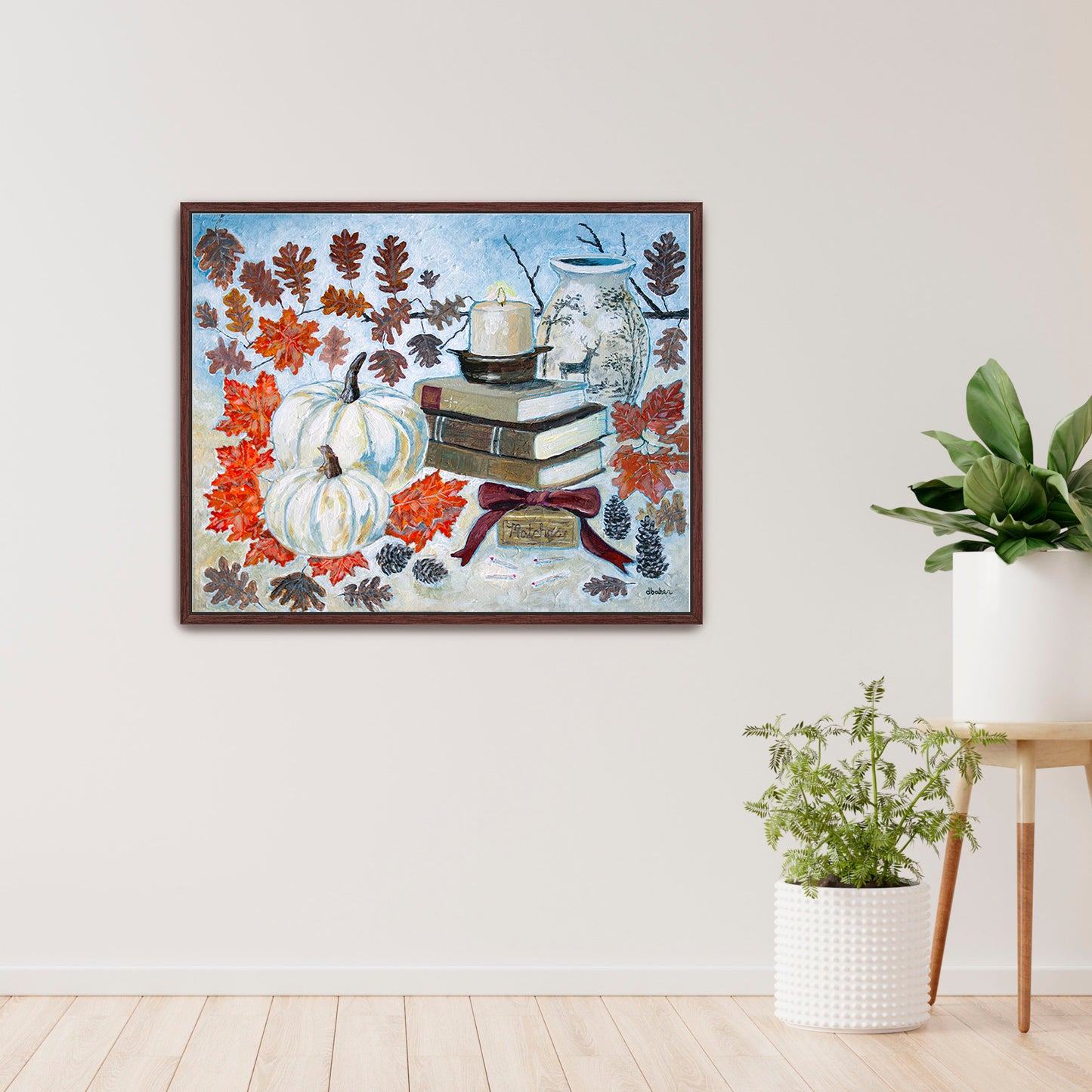 A painting of a cozy autumn still life featuring white pumpkins, vintage books, a red velvet bow and warm fall leaves. A perfect rustic accent for your home decor.
