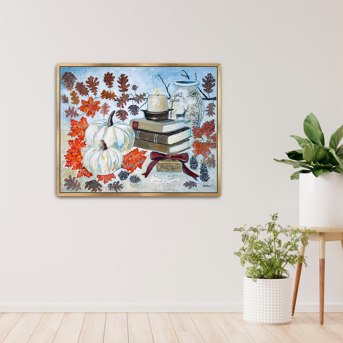 A painting of a cozy autumn still life featuring white pumpkins, vintage books, a red velvet bow and warm fall leaves. A perfect rustic accent for your home decor.