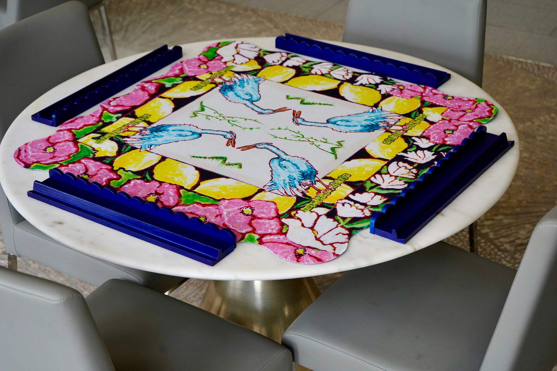A beautiful Mahjong Mat with original art of a Heron, anemone flowers, Lilly of the valley flowers and lemons.