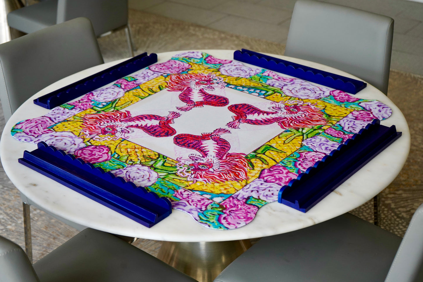 A beautiful and colorful mahjong mat featuring a red dragon with roses and pineapples.