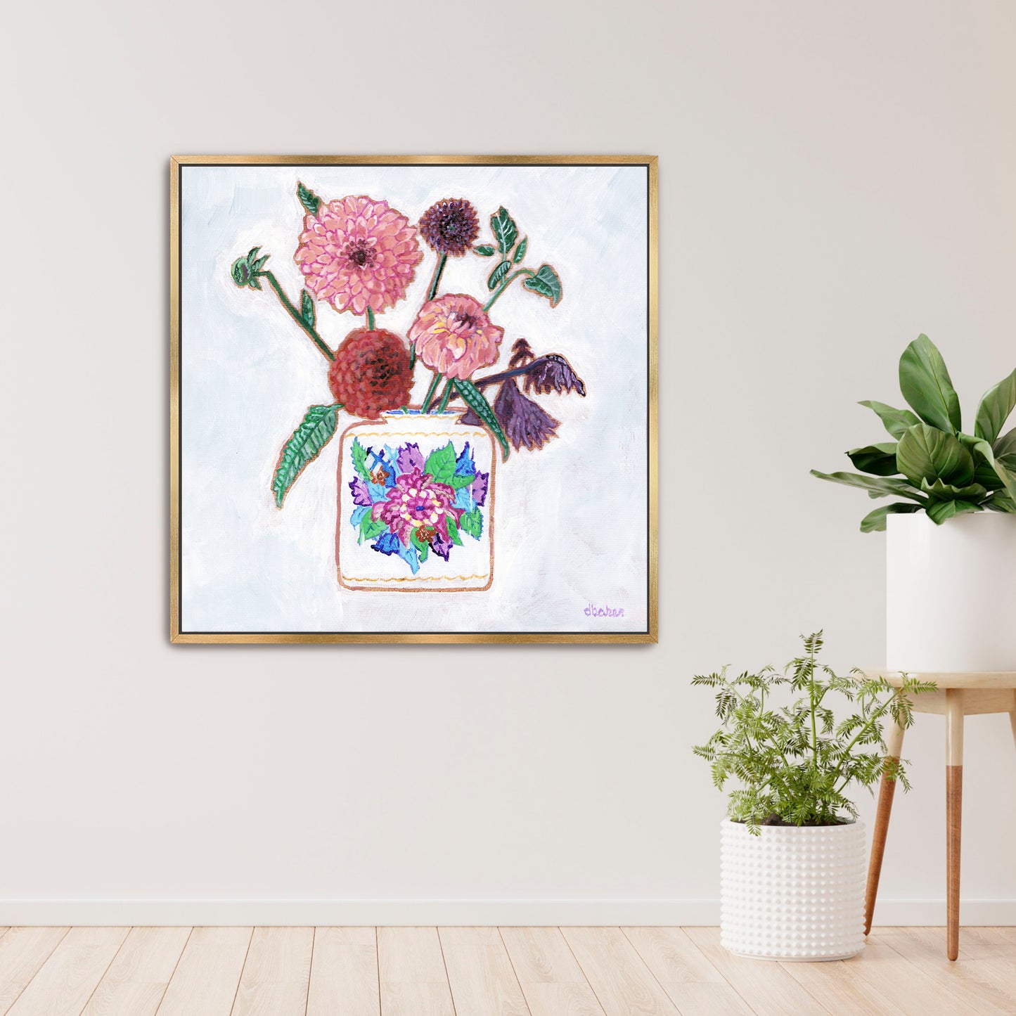 Vibrant dahlias bloom from a classic tobacco leaf vase, blending bold color, texture, and tradition in a modern still life