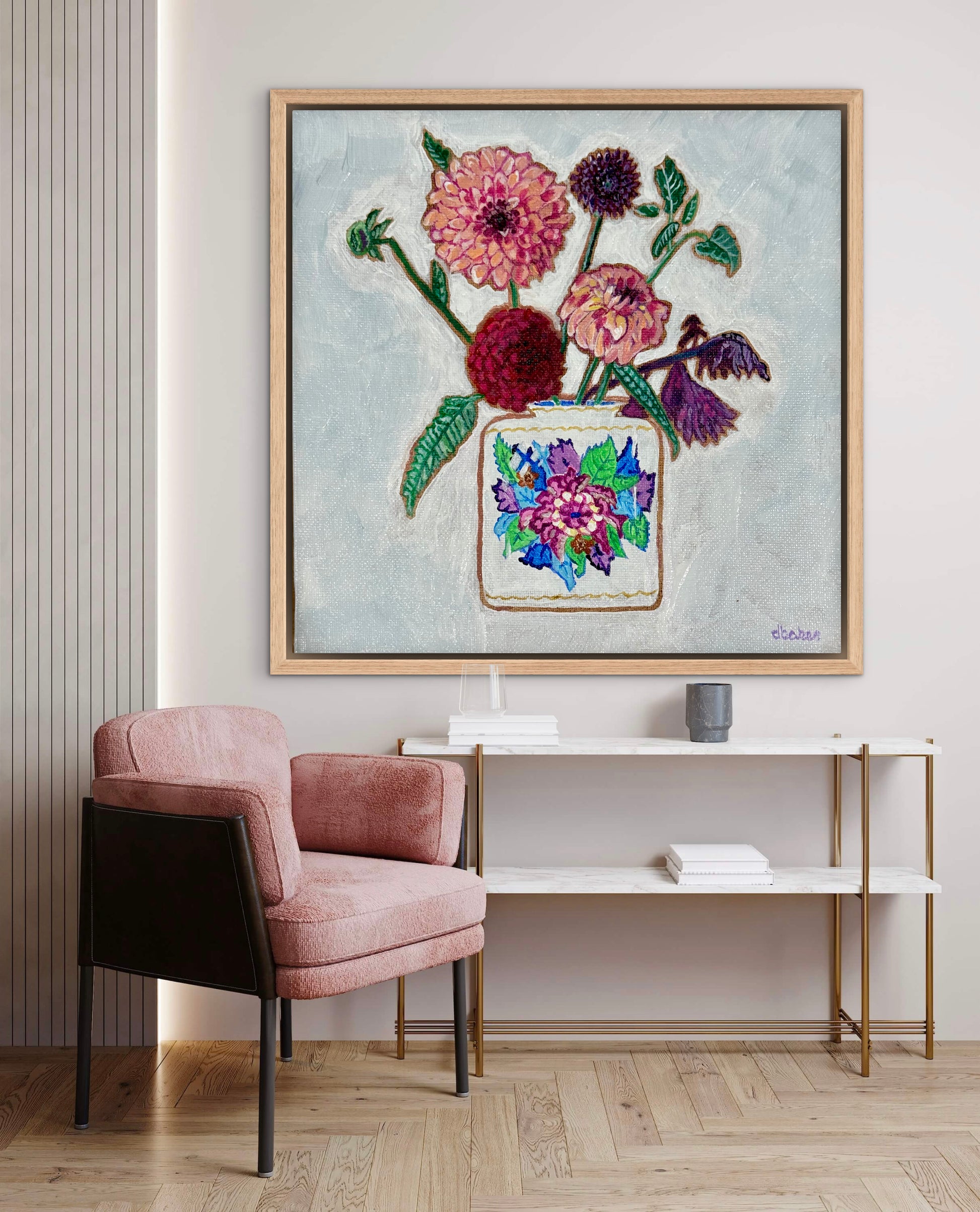 Vibrant dahlias bloom from a classic tobacco leaf vase, blending bold color, texture, and tradition in a modern still life