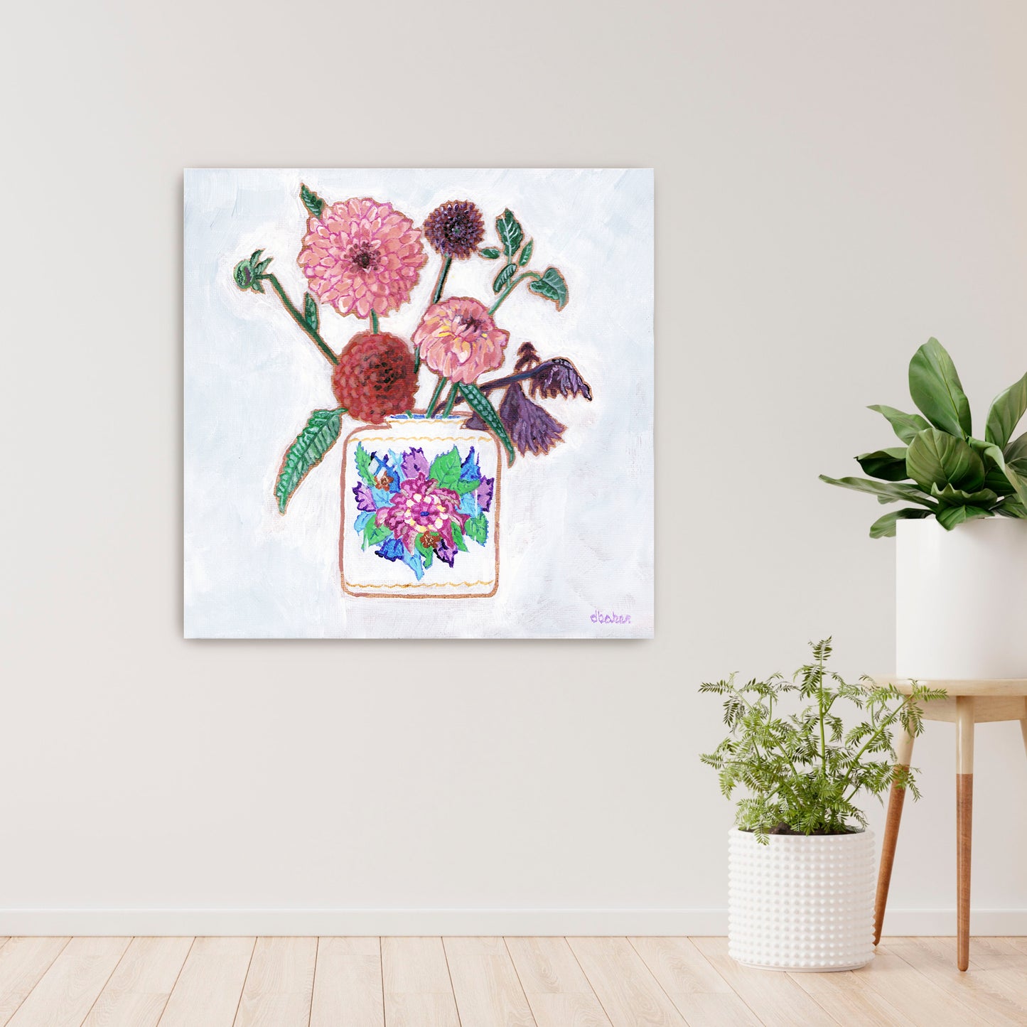 Vibrant dahlias bloom from a classic tobacco leaf vase, blending bold color, texture, and tradition in a modern still life