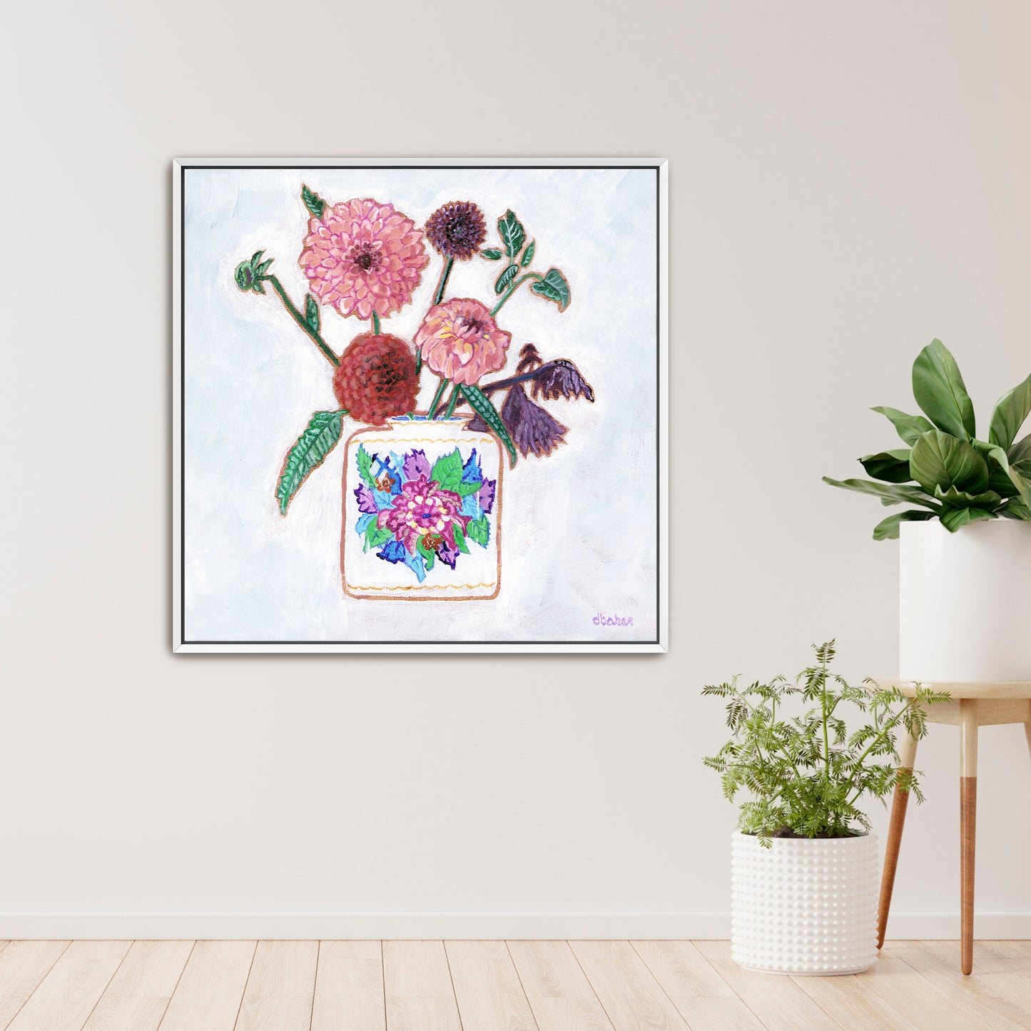 Vibrant dahlias bloom from a classic tobacco leaf vase, blending bold color, texture, and tradition in a modern still life