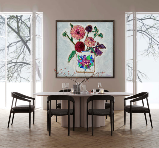 Vibrant dahlias bloom from a classic tobacco leaf vase, blending bold color, texture, and tradition in a modern still life