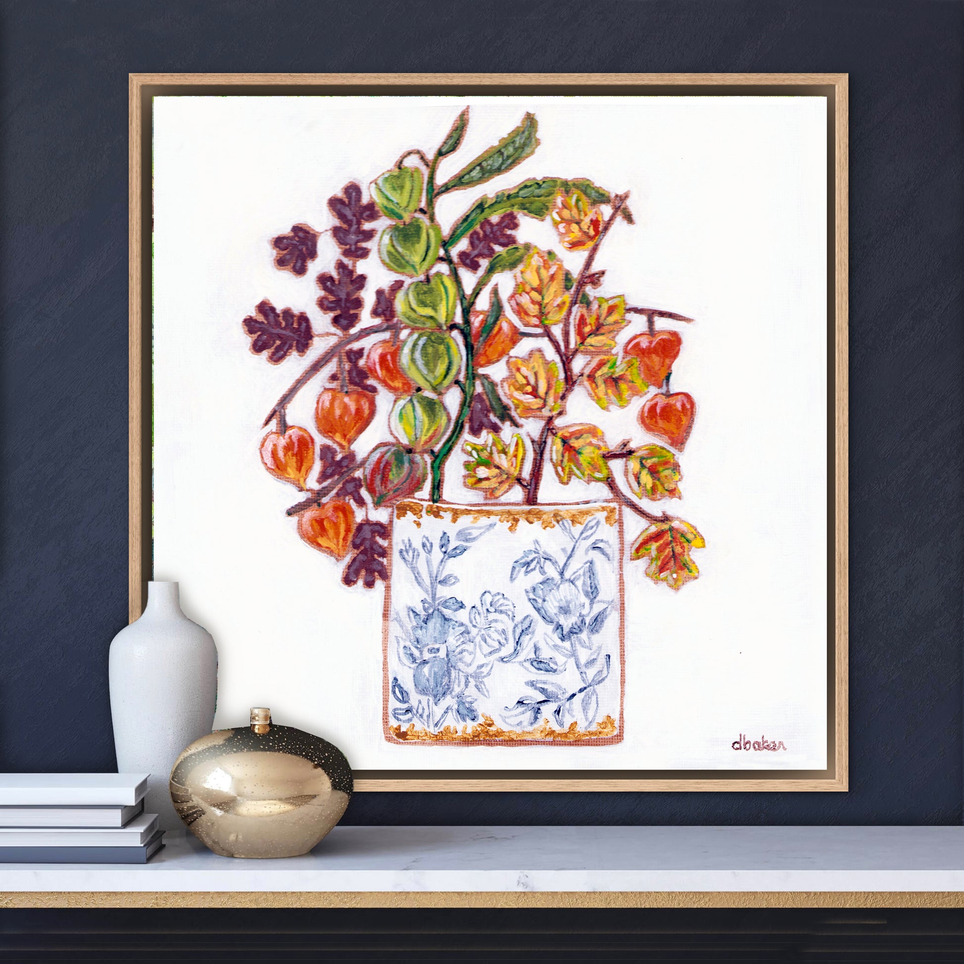 A delicate still life featuring vibrant orange and green lantern flowers arranged in a blue-and-white porcelain vase.
