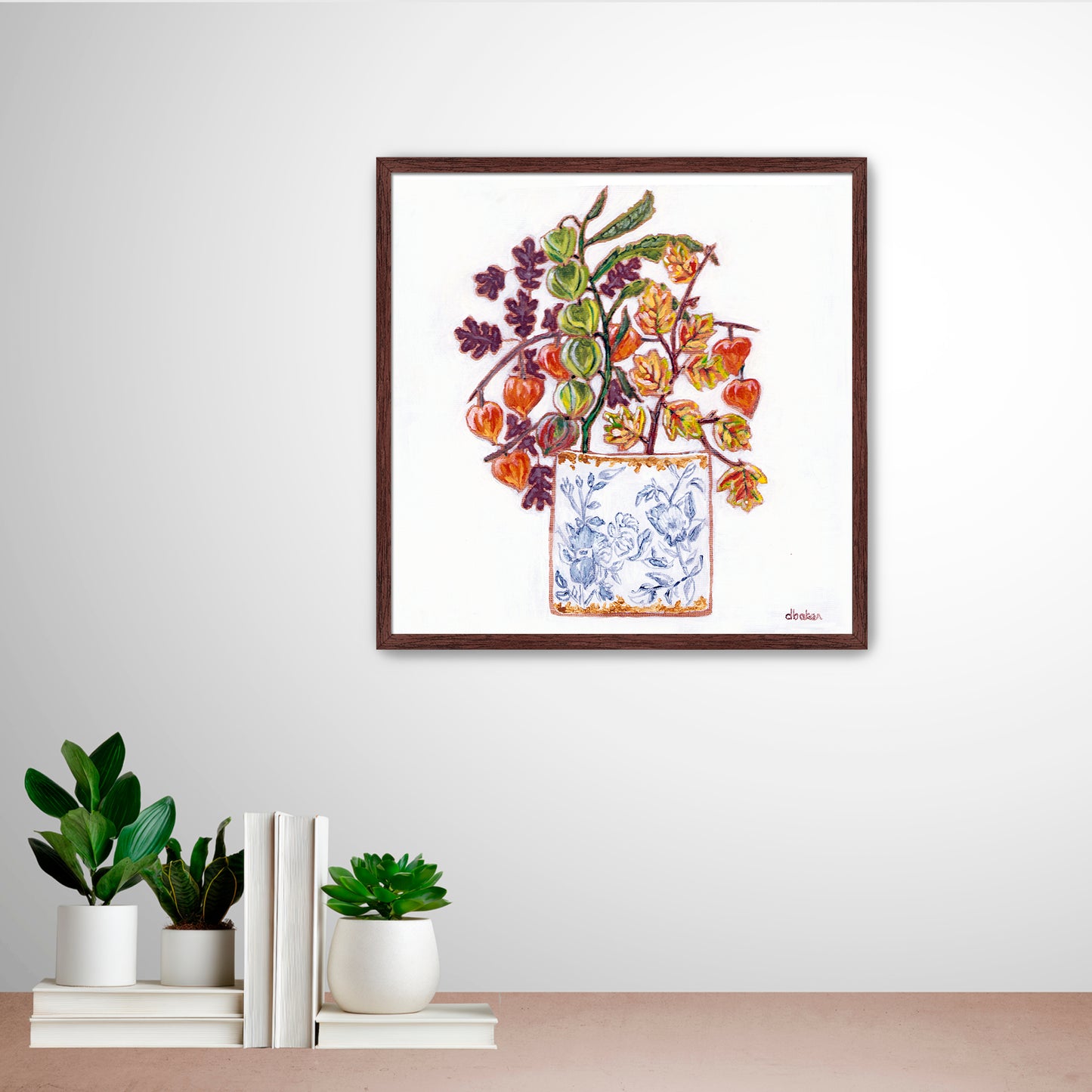 A delicate still life featuring vibrant orange and green lantern flowers arranged in a blue-and-white porcelain vase.