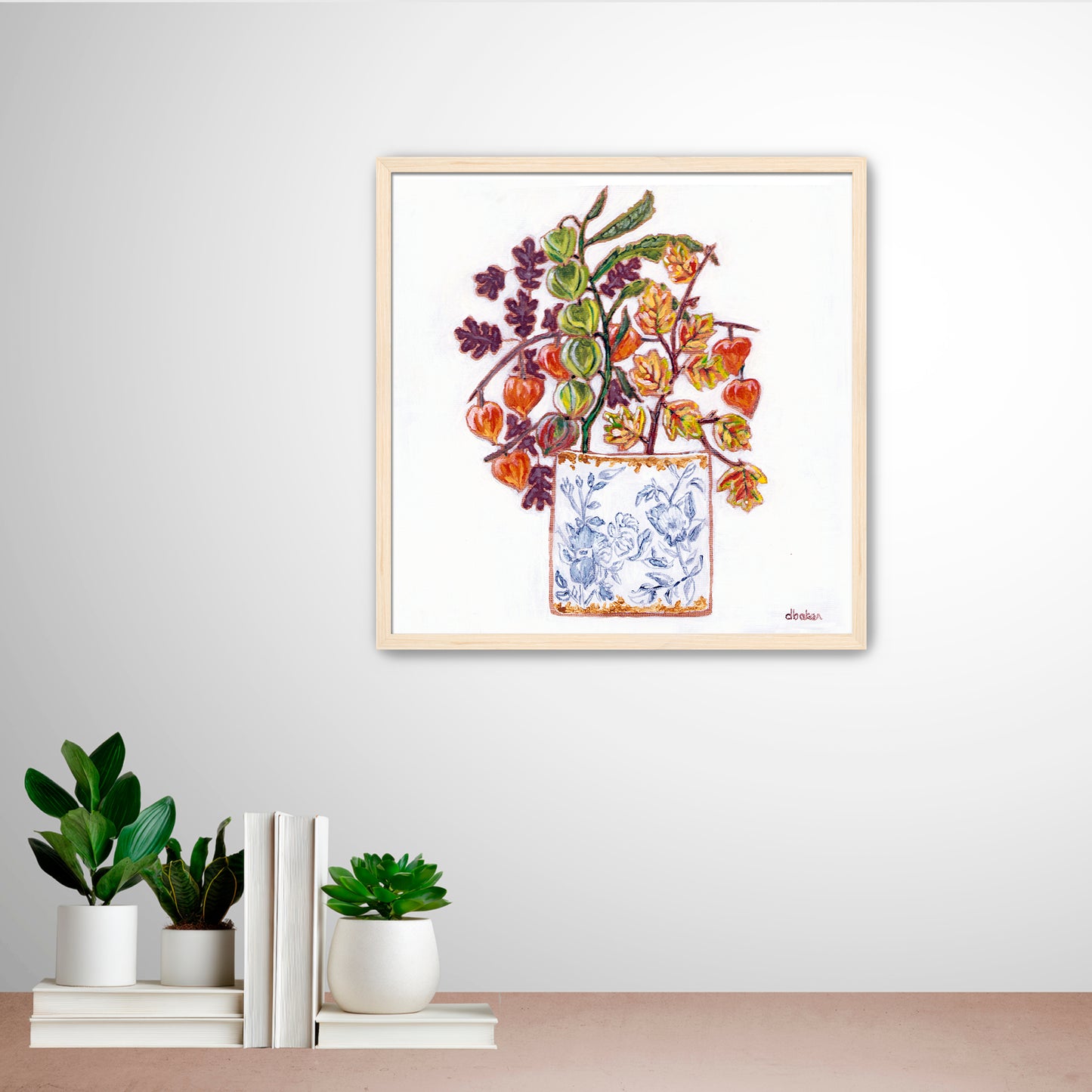 A delicate still life featuring vibrant orange and green lantern flowers arranged in a blue-and-white porcelain vase.