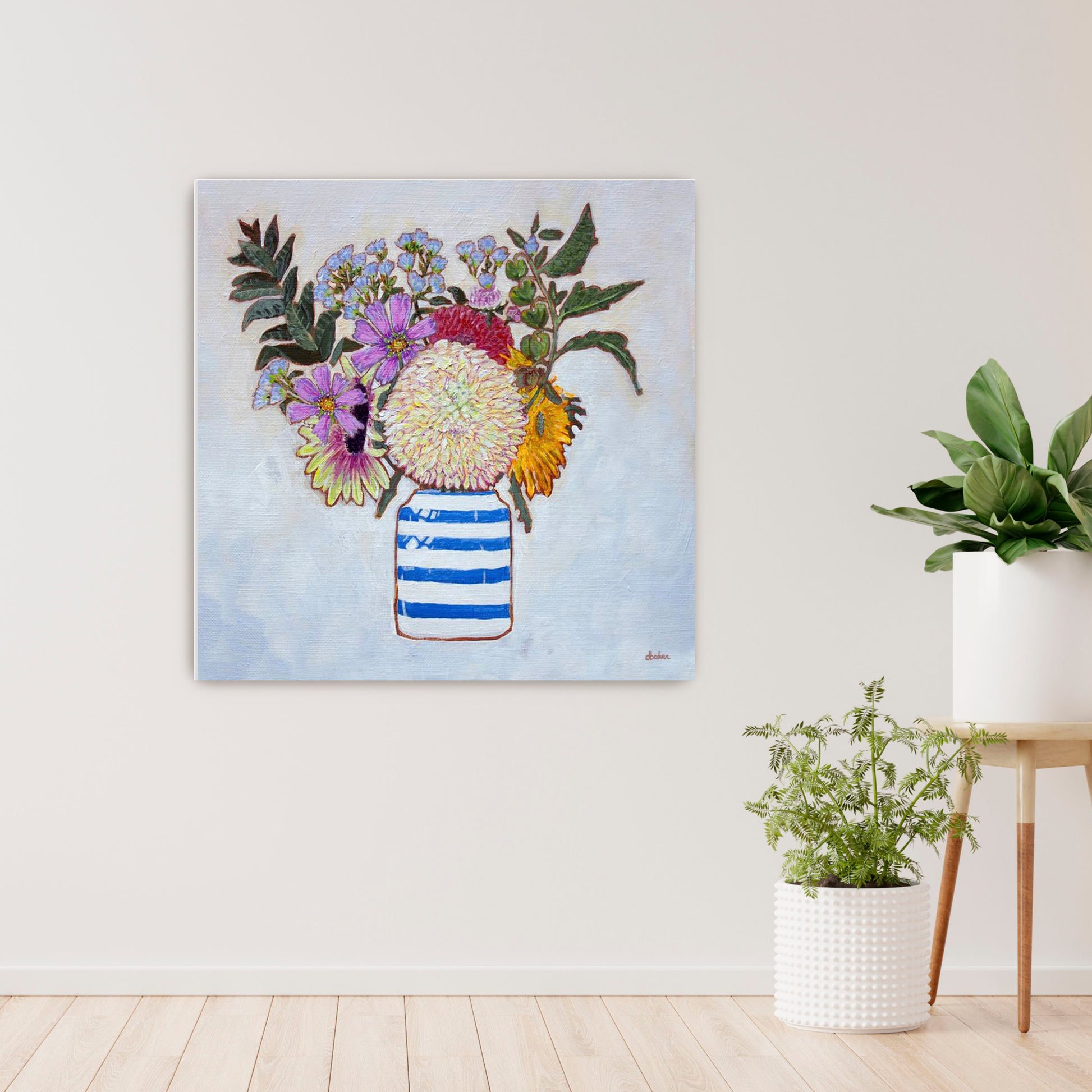 A whimsical and colorful painting of dahlias and wildflowers in a blue and white striped vase.