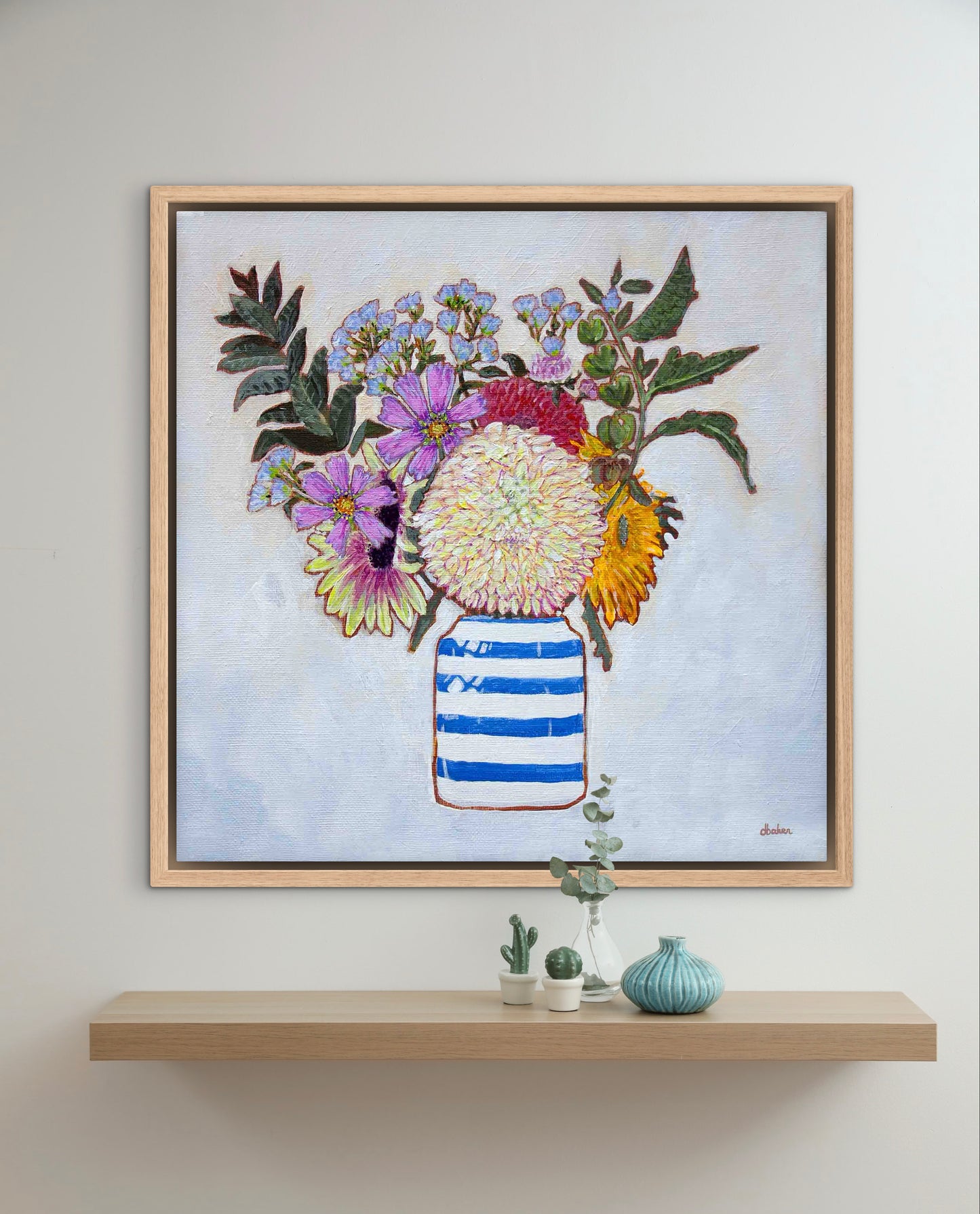 A whimsical and colorful painting of dahlias and wildflowers in a blue and white striped vase.