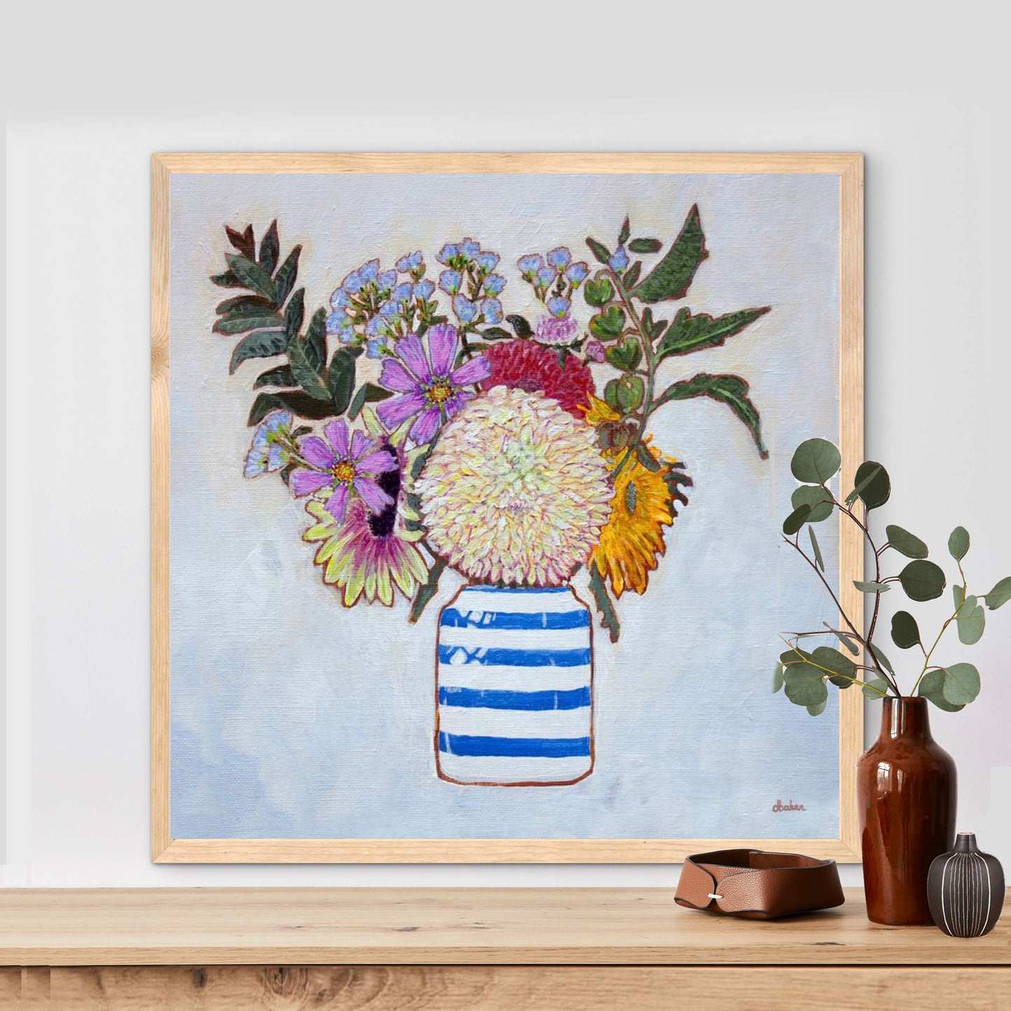 A whimsical and colorful painting of dahlias and wildflowers in a blue and white striped vase.