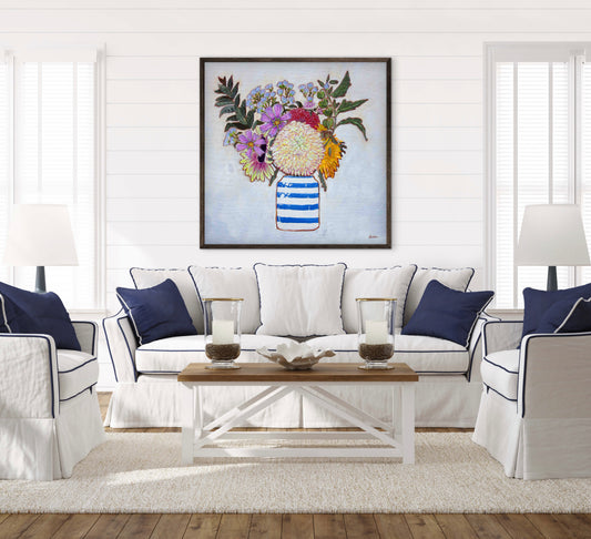 A whimsical and colorful painting of dahlias and wildflowers in a blue and white striped vase.