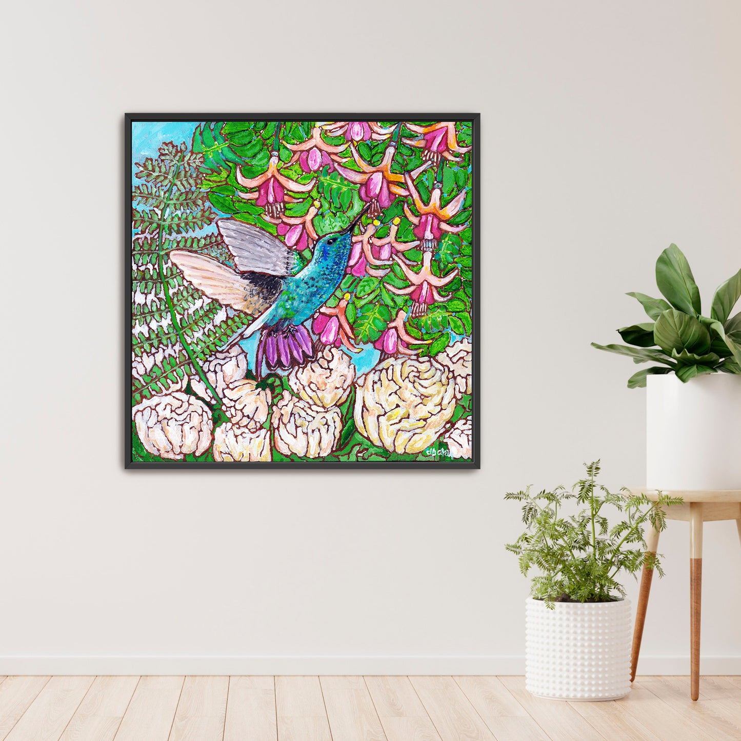 A colorful painting of a hummingbird in a fuchsia flower plant hovering over peony flowers.