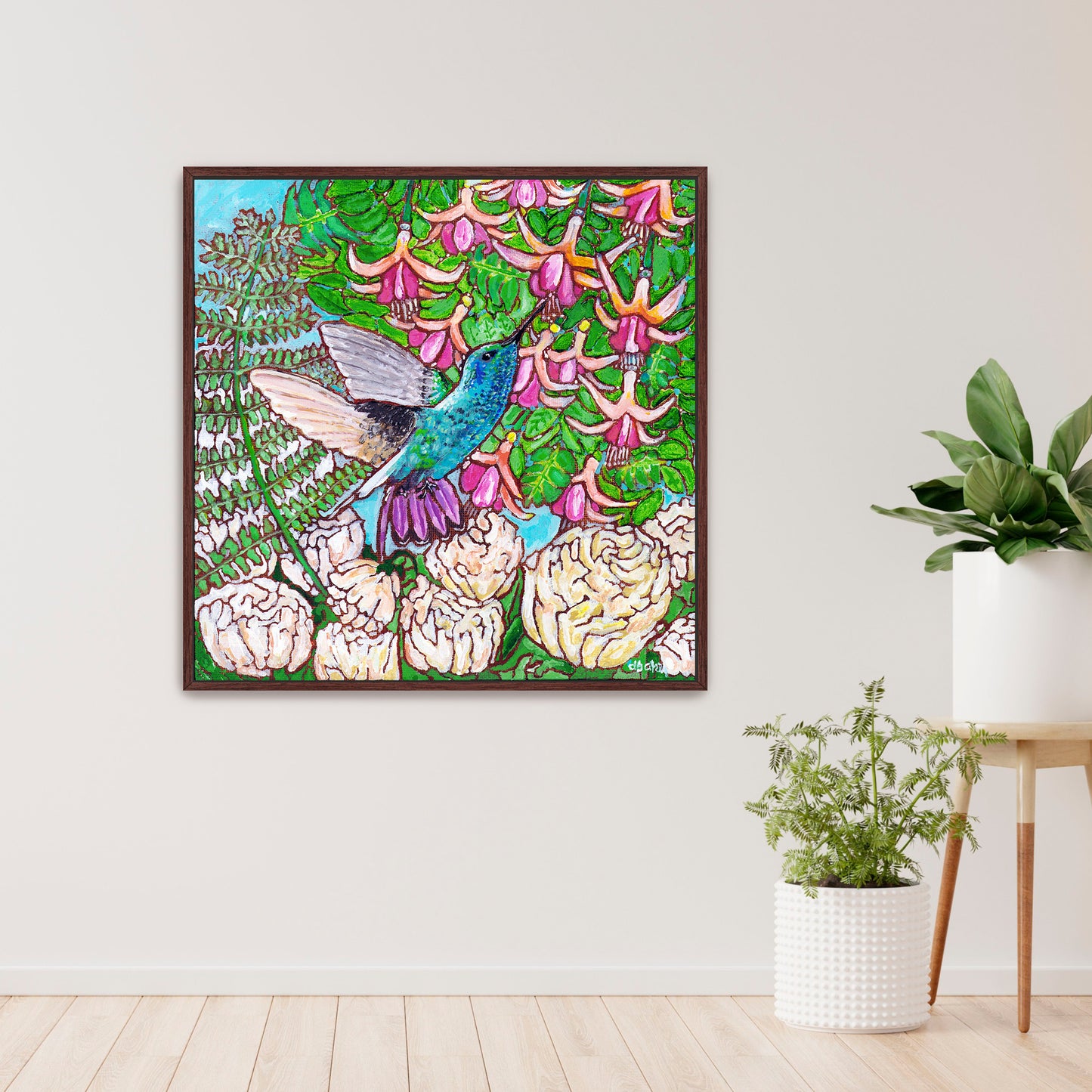 A colorful painting of a hummingbird in a fuchsia flower plant hovering over peony flowers.