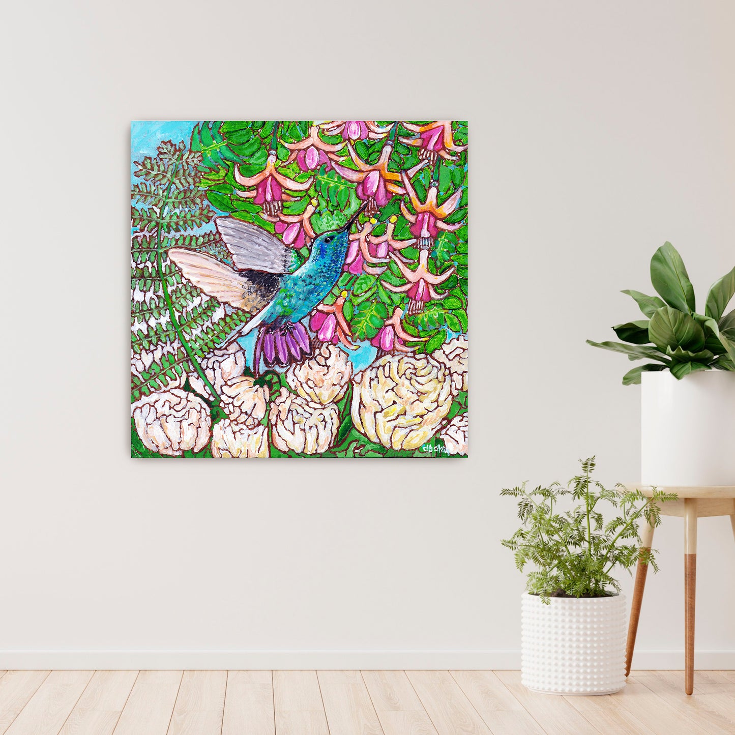 A colorful painting of a hummingbird in a fuchsia flower plant hovering over peony flowers.