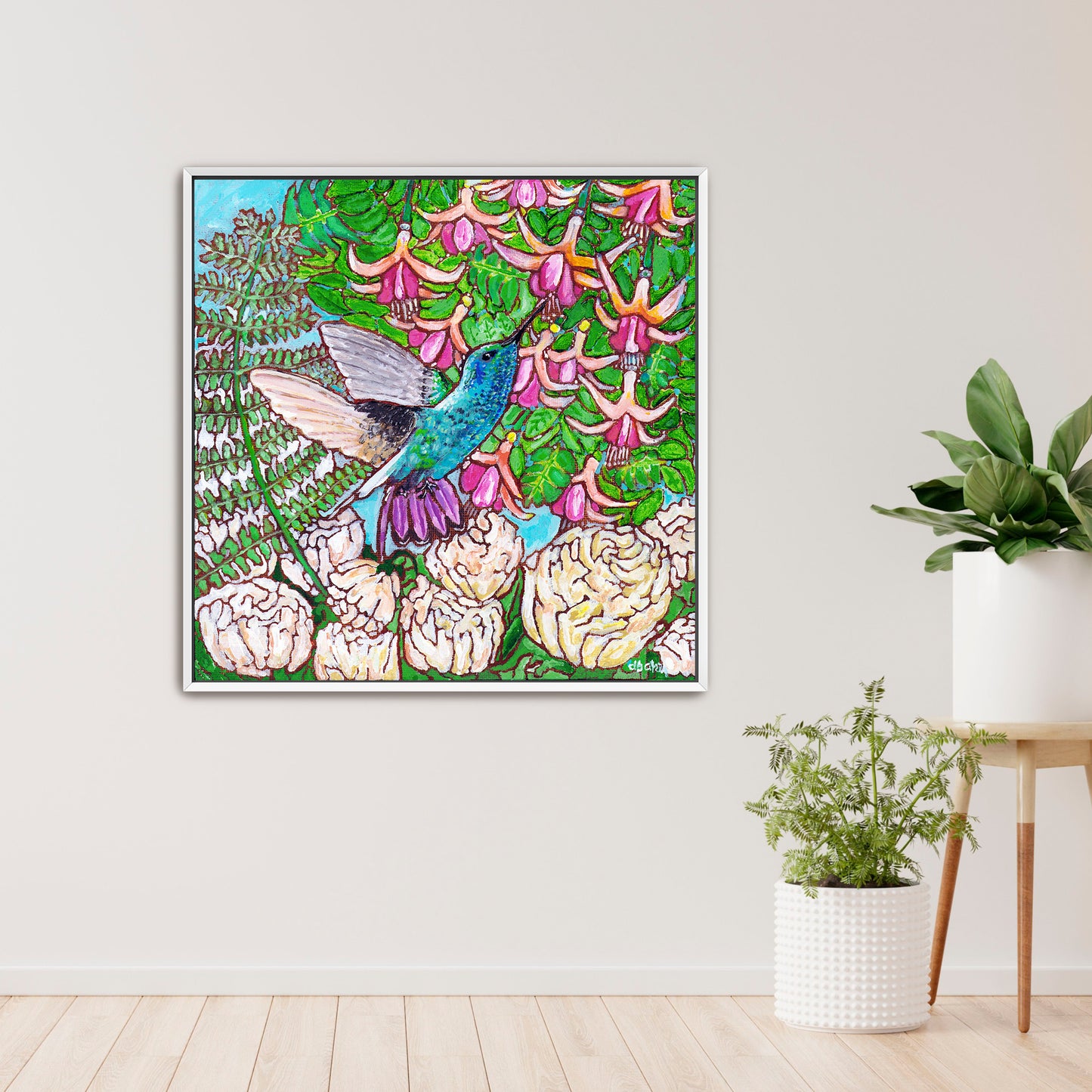 A colorful painting of a hummingbird in a fuchsia flower plant hovering over peony flowers.