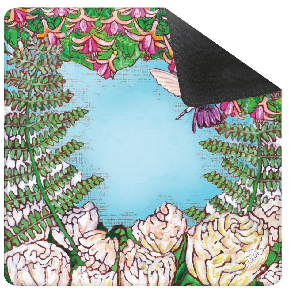 A Mahjong Mat with a colorful painting of a hummingbird in a fuchsia flower plant hovering over peony flowers painted by Deb Baker at Trail East Studio in Ada Michigan