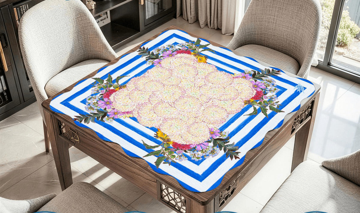 A whimsical and colorful mahjong mat based on a  painting of dahlias and wildflowers in a blue and white striped vase.