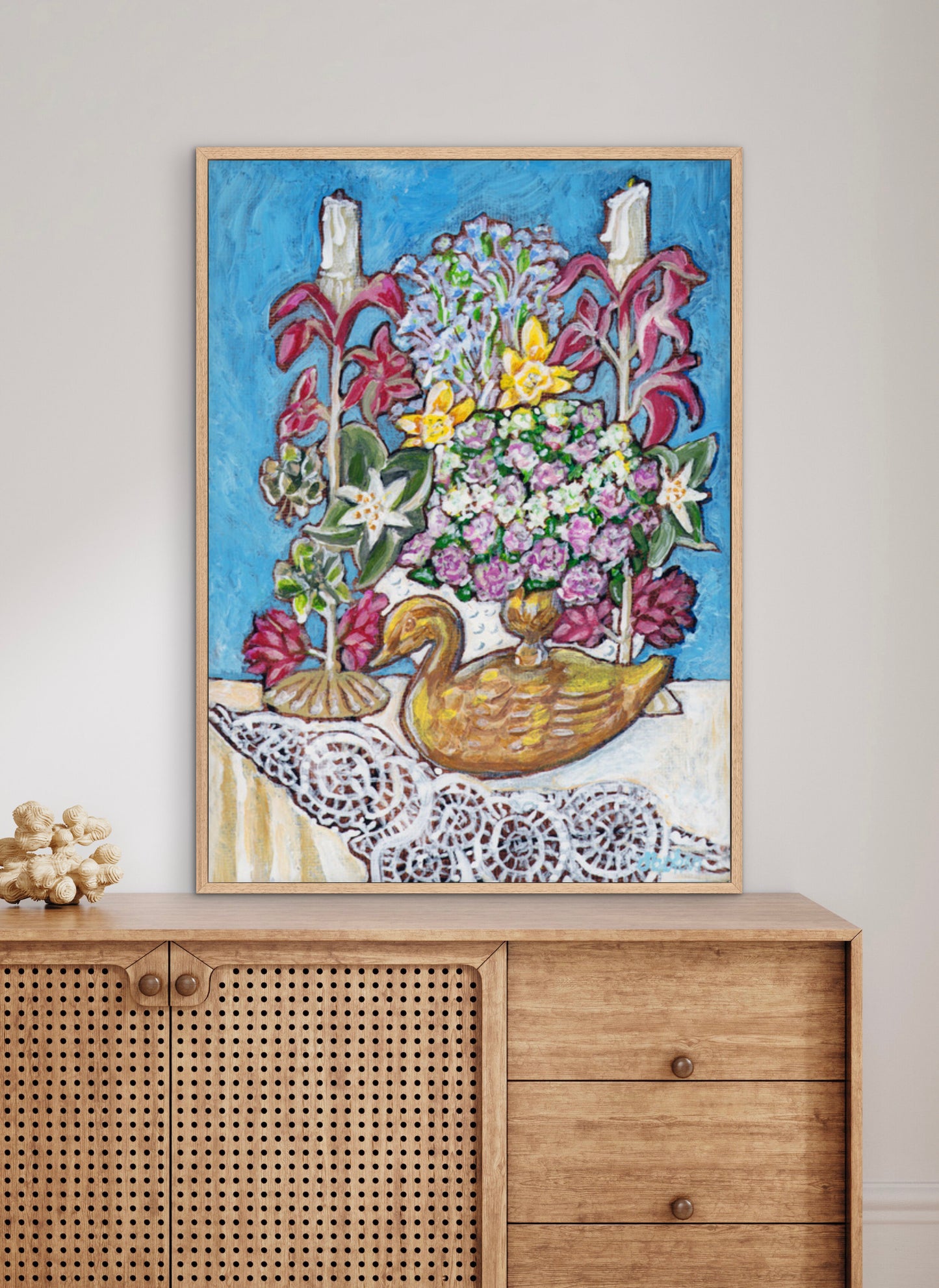 A painting from Trail East Studio of antique tole candleholders and an antique swan candleholder filled with flowers on a crocheted lace tablecloth