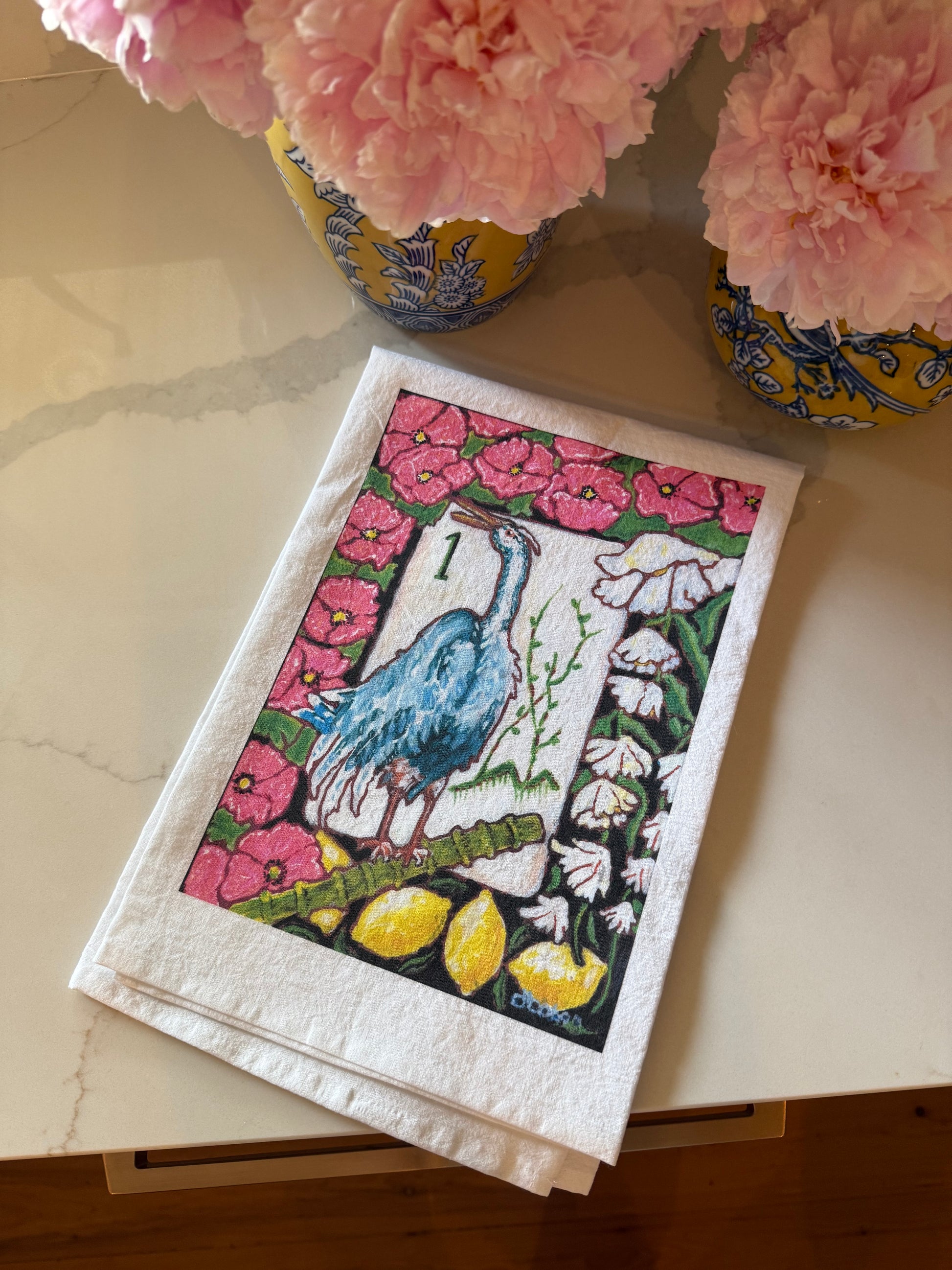 The perfect Mahjong hostess gift. A beautiful painting  of a heron among flowers and lemons inspired by a vintage Bird Bam Mahjong Tile printed on a 100% cotton tea towel.