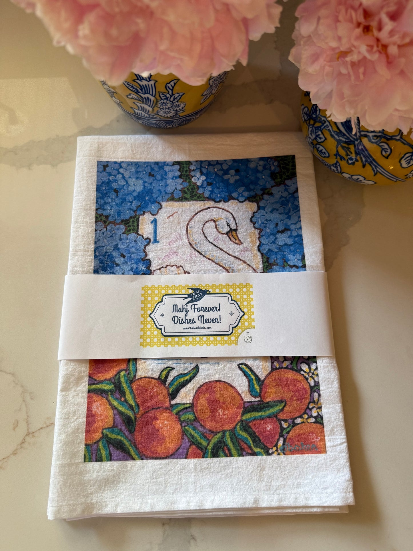 The perfect Mahjong hostess gift. A beautiful painting  of a swan among hydrangeas and oranges inspired by a vintage Bird Bam Mahjong Tile printed on a 100% cotton tea towel.