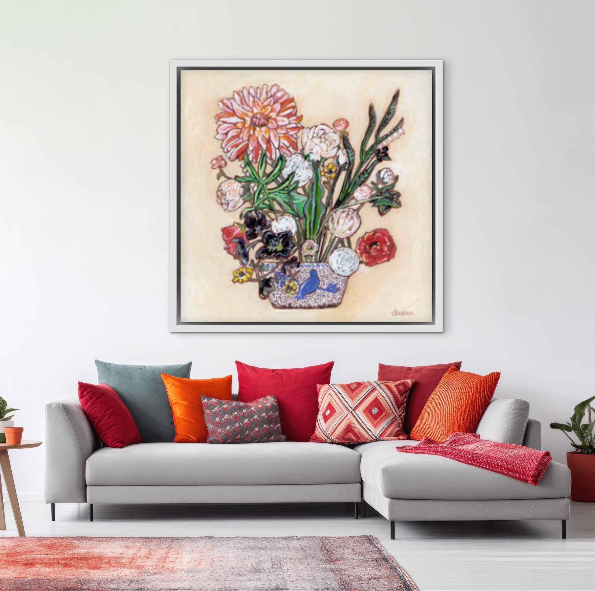 A painting of a colorful flowers including a large dahlia  in a blue and white bird vase.