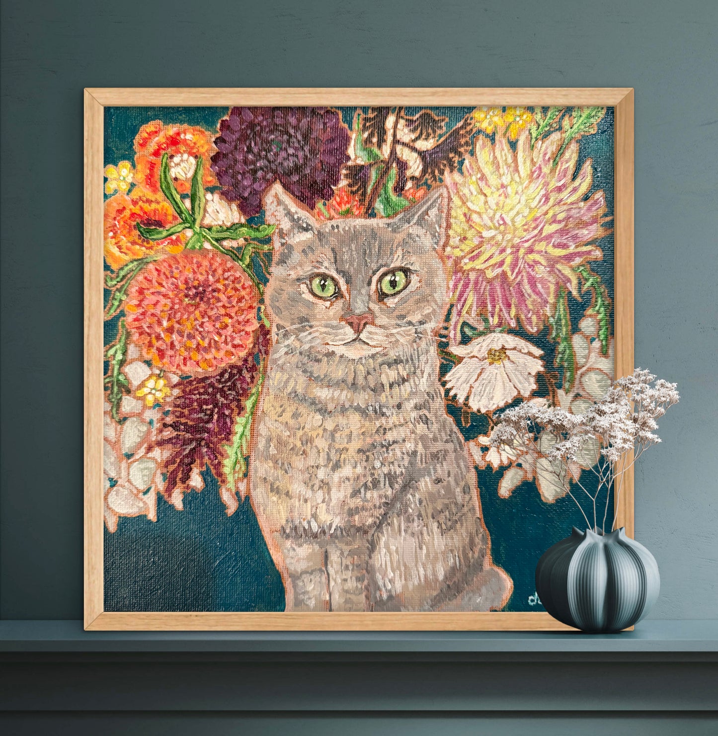 This painting is a loving portrait of Moses my gray cat shown sitting calmly in front of a rich bouquet of flowers including vibrant dahlias.