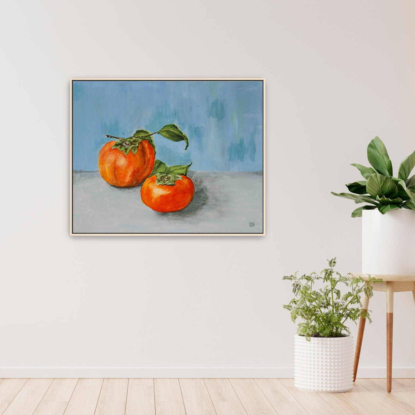 A beautiful  oil painting of two persimmons on a blue wall.