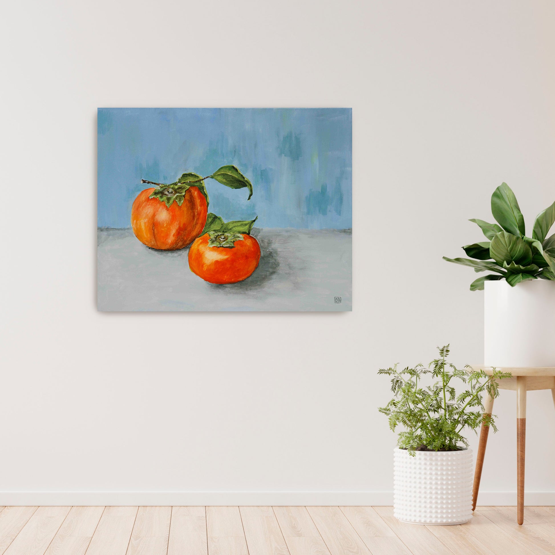 A beautiful  oil painting of two persimmons on a blue wall.
