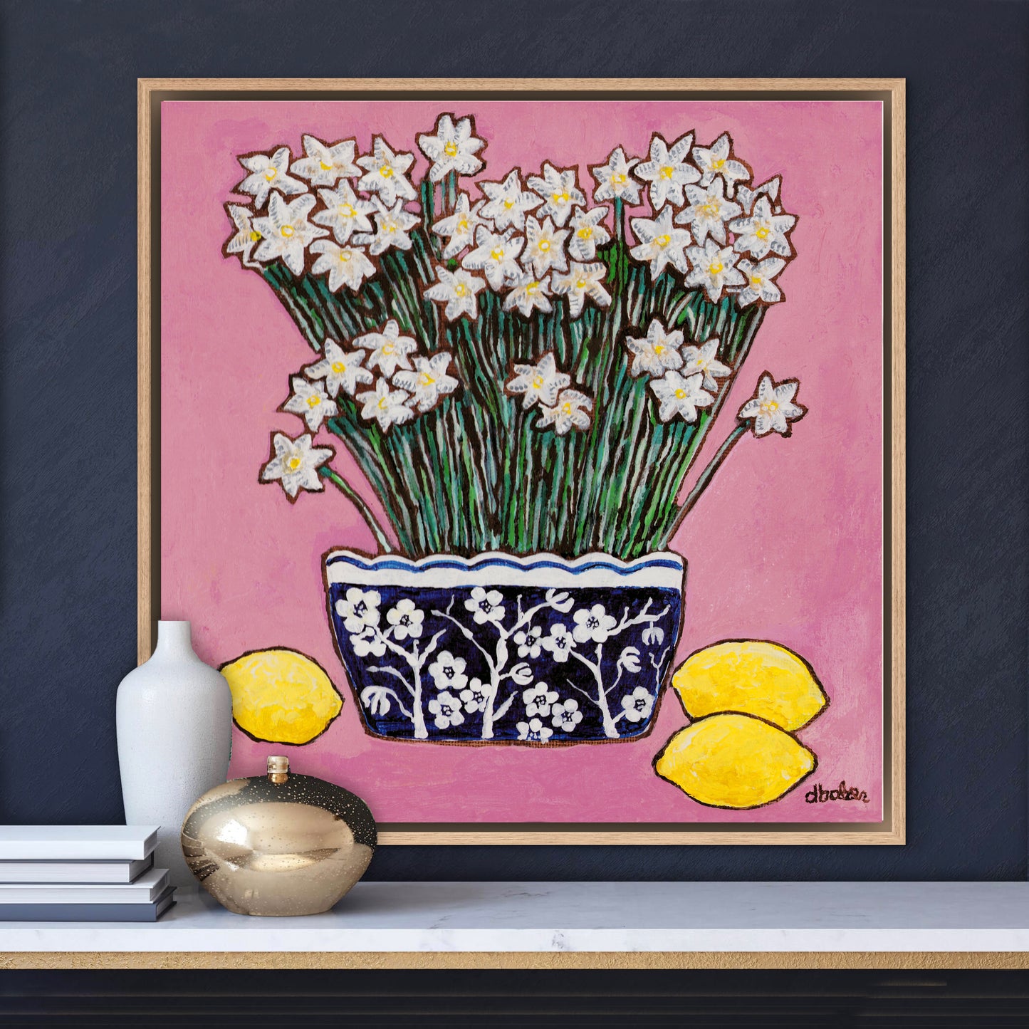 A whimsical painting of paperwhites in a blue and white floral vase surrounded by lemons against a bright pink background.