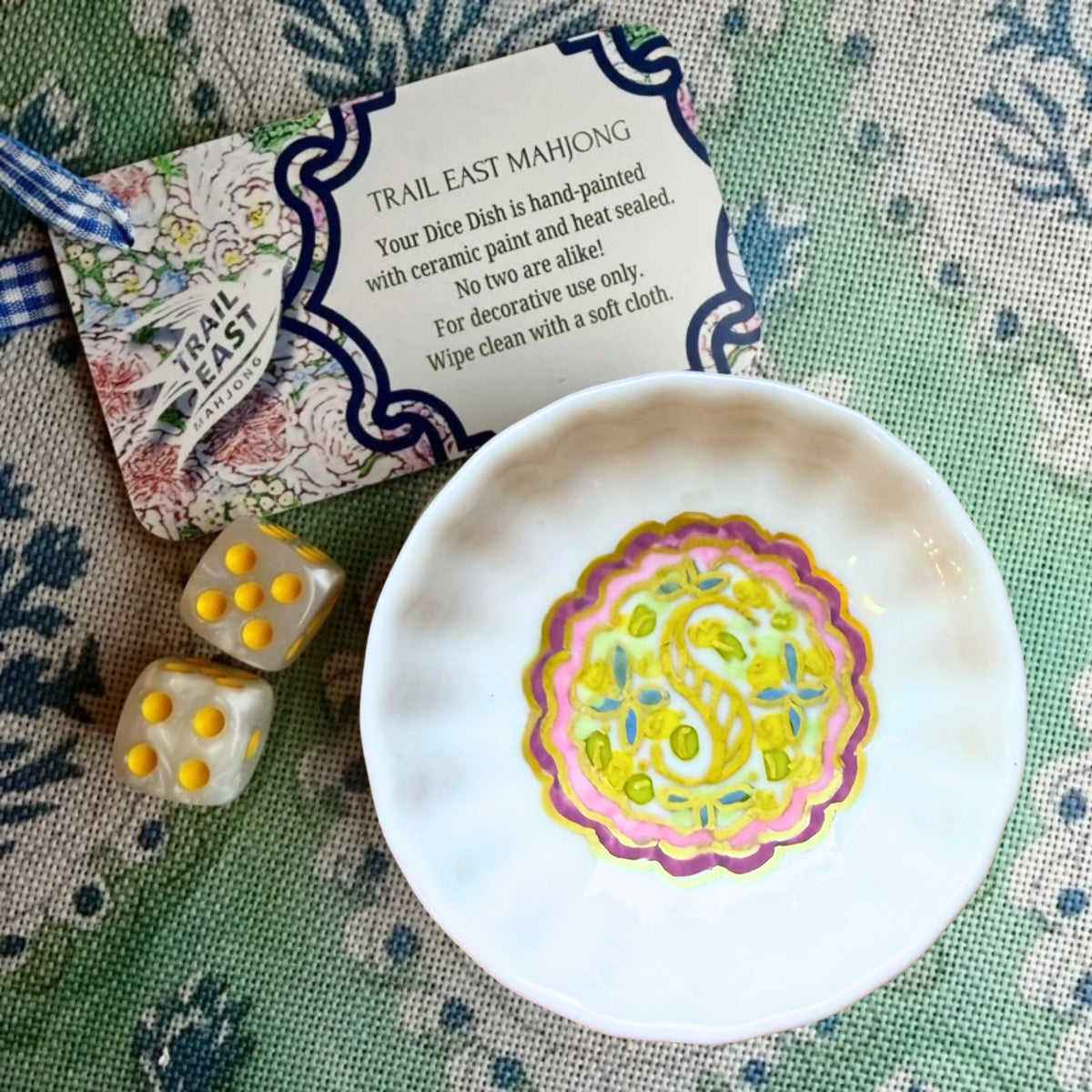 A hand painted monogrammed dice dish featuring a floral motif from Trail East Studio in Ada Michigan