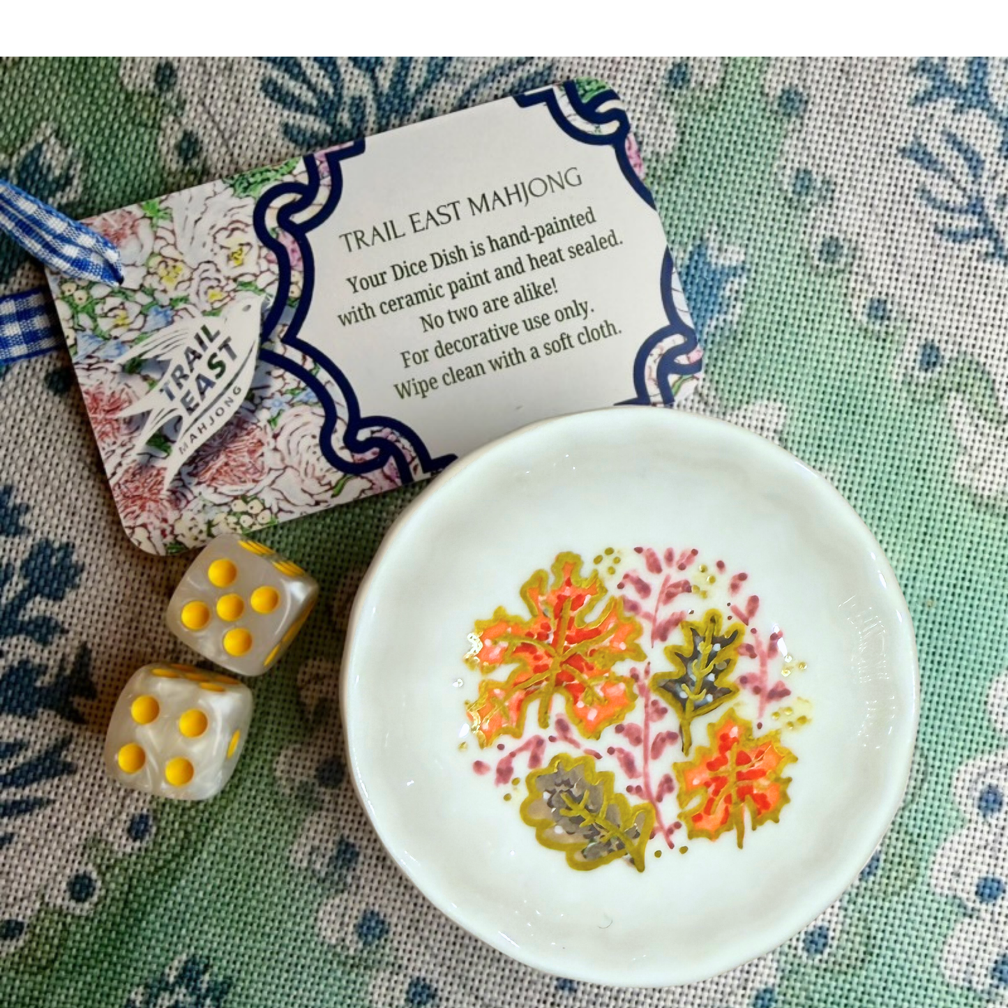 A hand painted mahjong dice dish featuring Fall Leaves from Trail East Studio in Ada Michigan