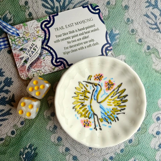 A hand painted Mahjong Dice Dish with vintage bird bam heron motif from Trail East Studio. The perfect hostess gift.