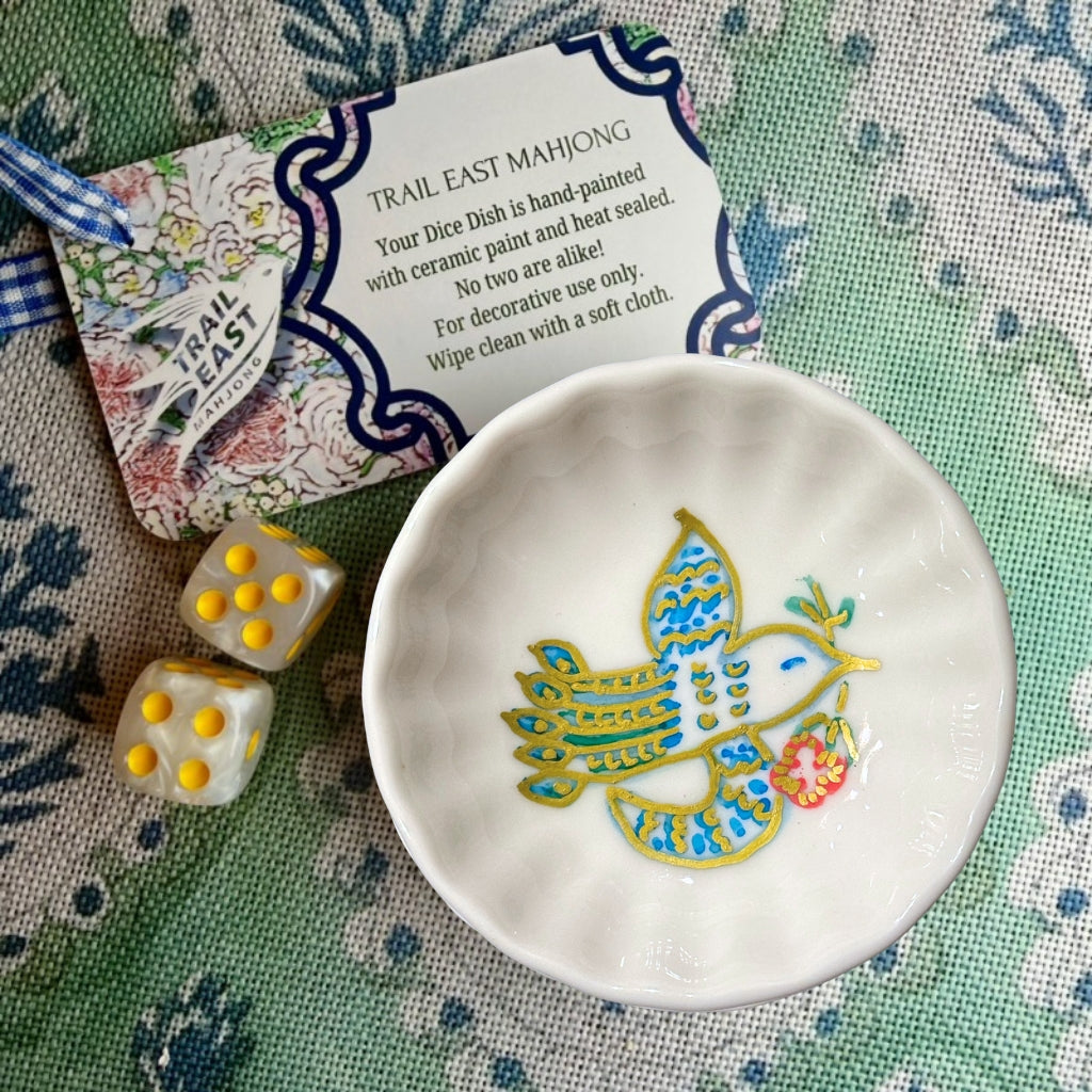A hand painted Mahjong Dice Dish with vintage bird bam motif from Trail East Studio. The perfect hostess gift.