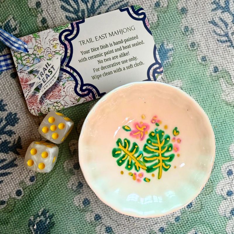 A hand painted Mahjong Dice Dish with a monstera leaf motif by Trail East Studio. The perfect hostess gift.