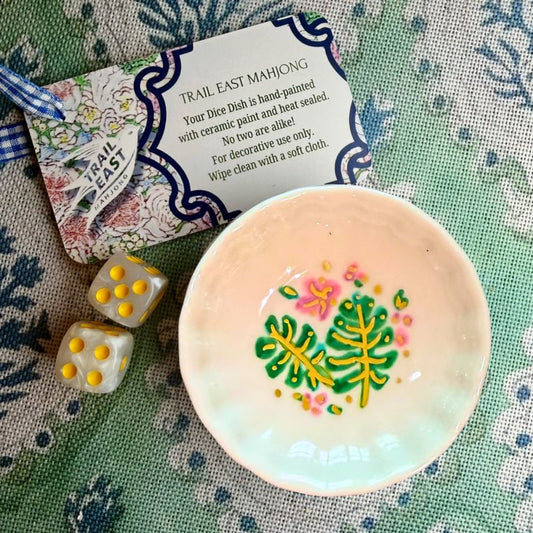 A hand painted Mahjong Dice Dish with a monstera leaf motif by Trail East Studio. The perfect hostess gift.