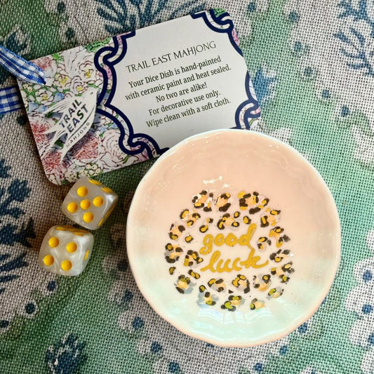 A hand painted Mahjong Dice Dish with a leopard print motif from Trail East Studio. The perfect hostess gift.