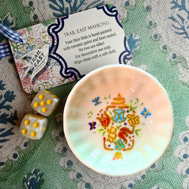 A hand painted dice dish from Trail East Studio featuring a lantern with flowers and butterflies