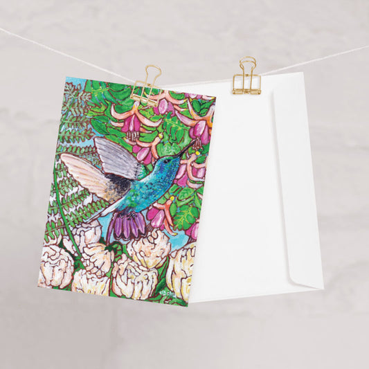 A greeting card from Trail East Studio featuring a painting of a hummingbird with peonies and fuchsia flowers