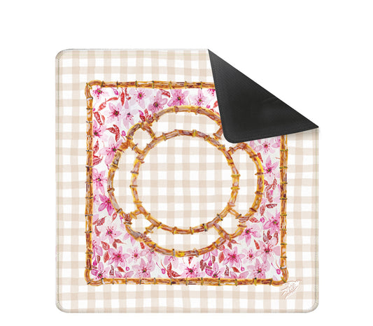 An original painting mahjong mat from Trail East Studio in Ada Michigan featuring cherry blossoms and a bamboo frame with a gingham background.